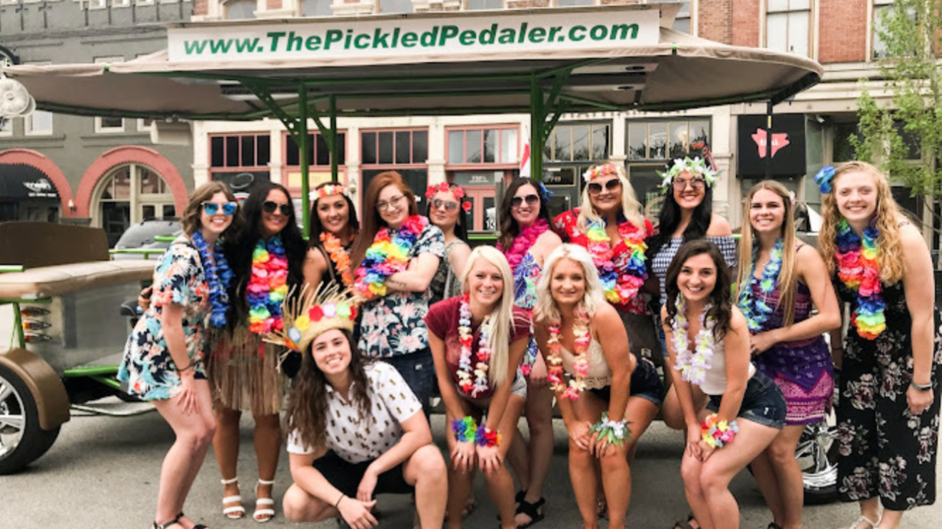 a group of people standing in front of a crowd posing for the camera