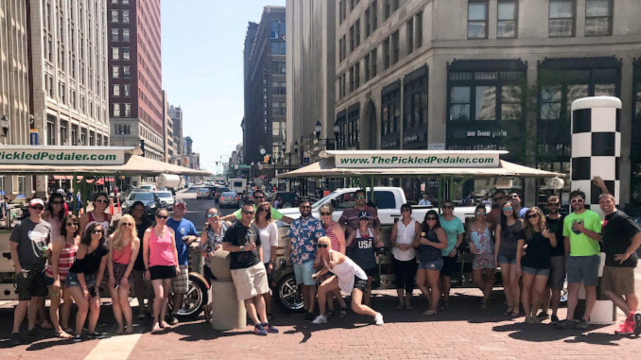a group of people walking on a city street