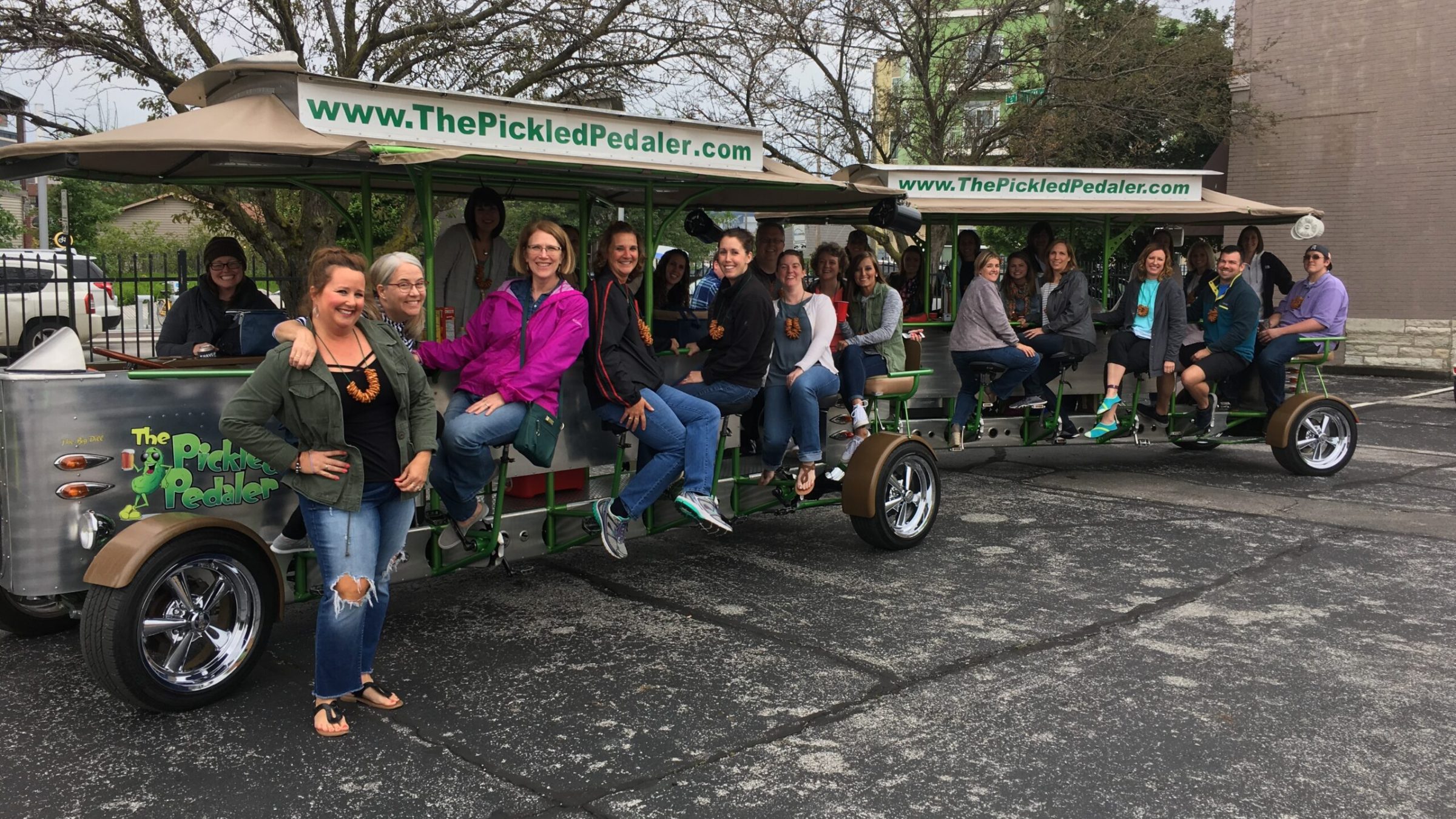 a group of people riding on the back of a truck