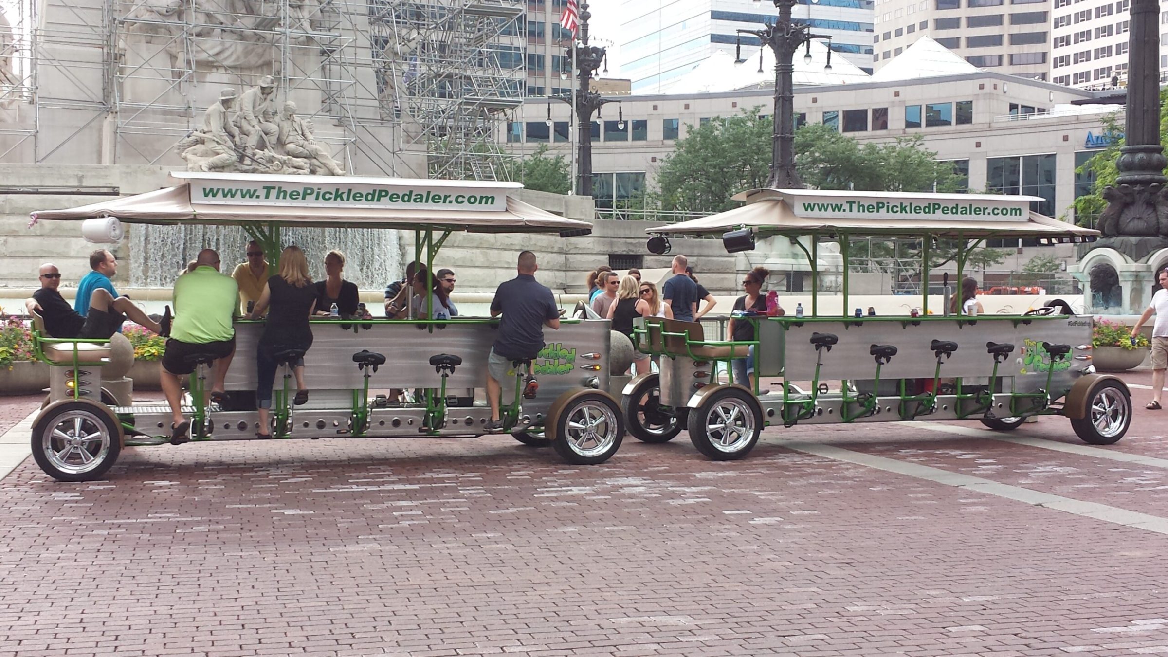 a group of people standing around a motorcycle in front of a building