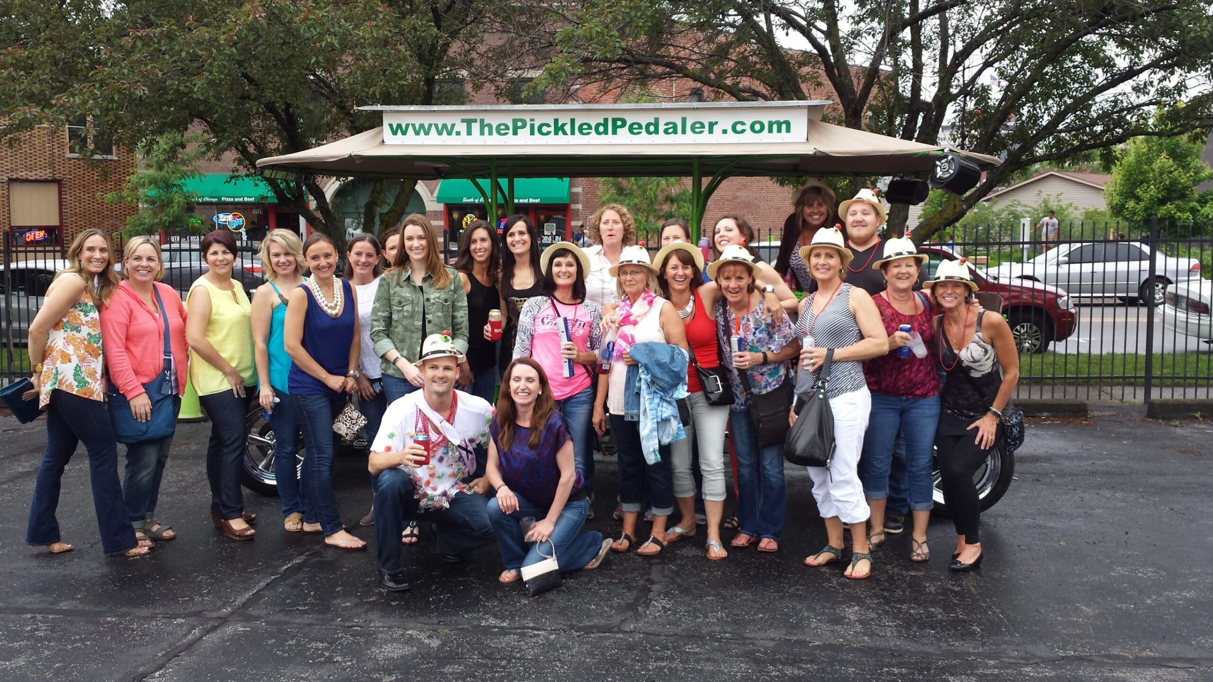 a group of people standing in front of a crowd posing for the camera
