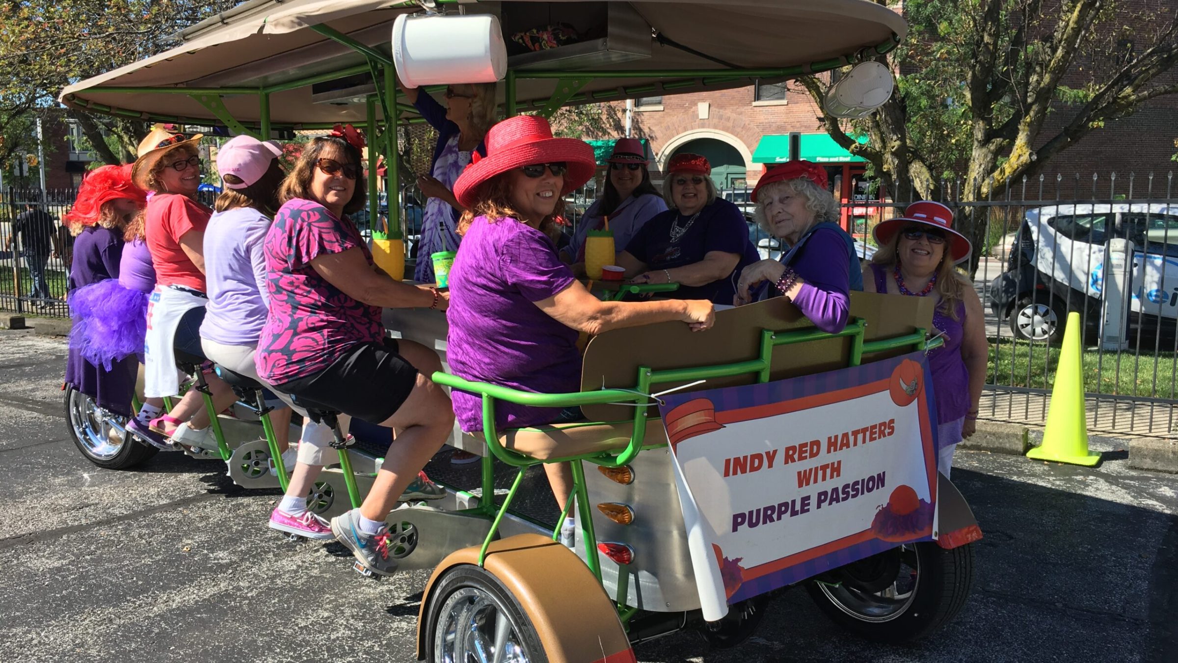 a group of people riding on the back of a truck