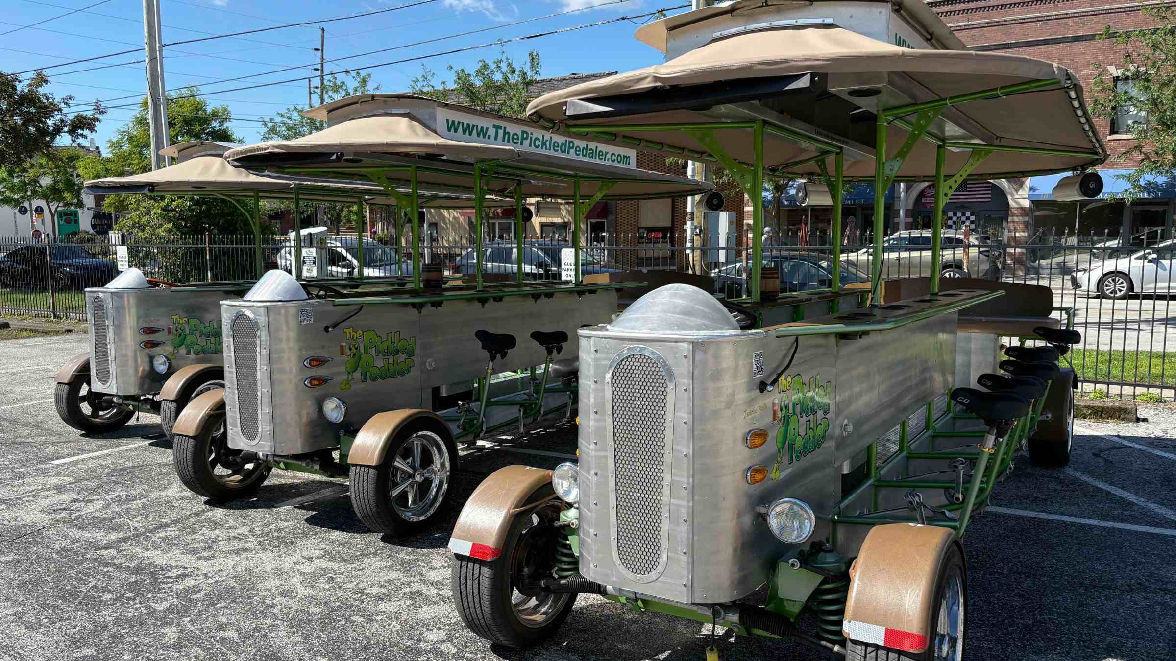a group of people sitting in a parking lot