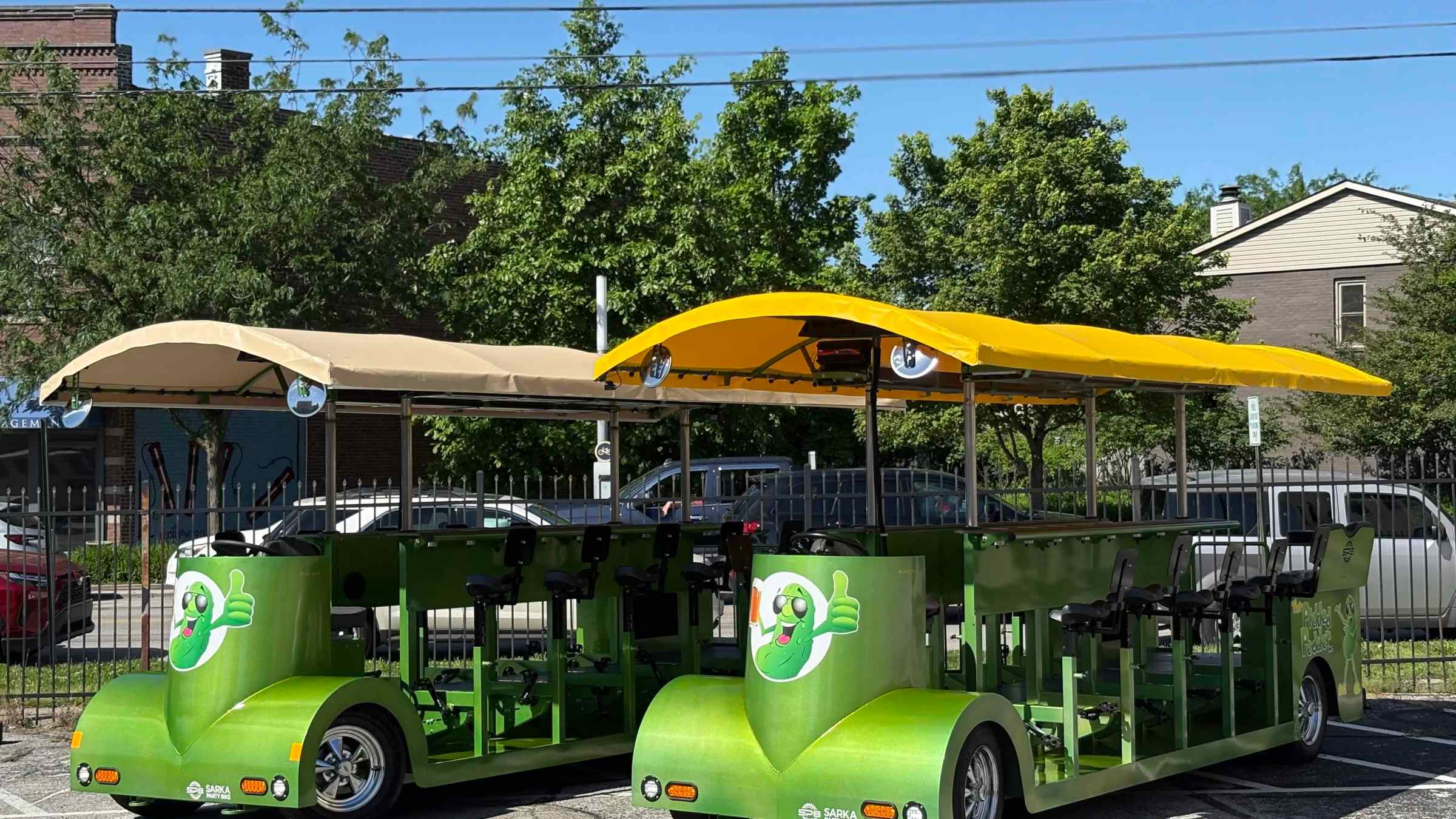 a green bus parked in a parking lot