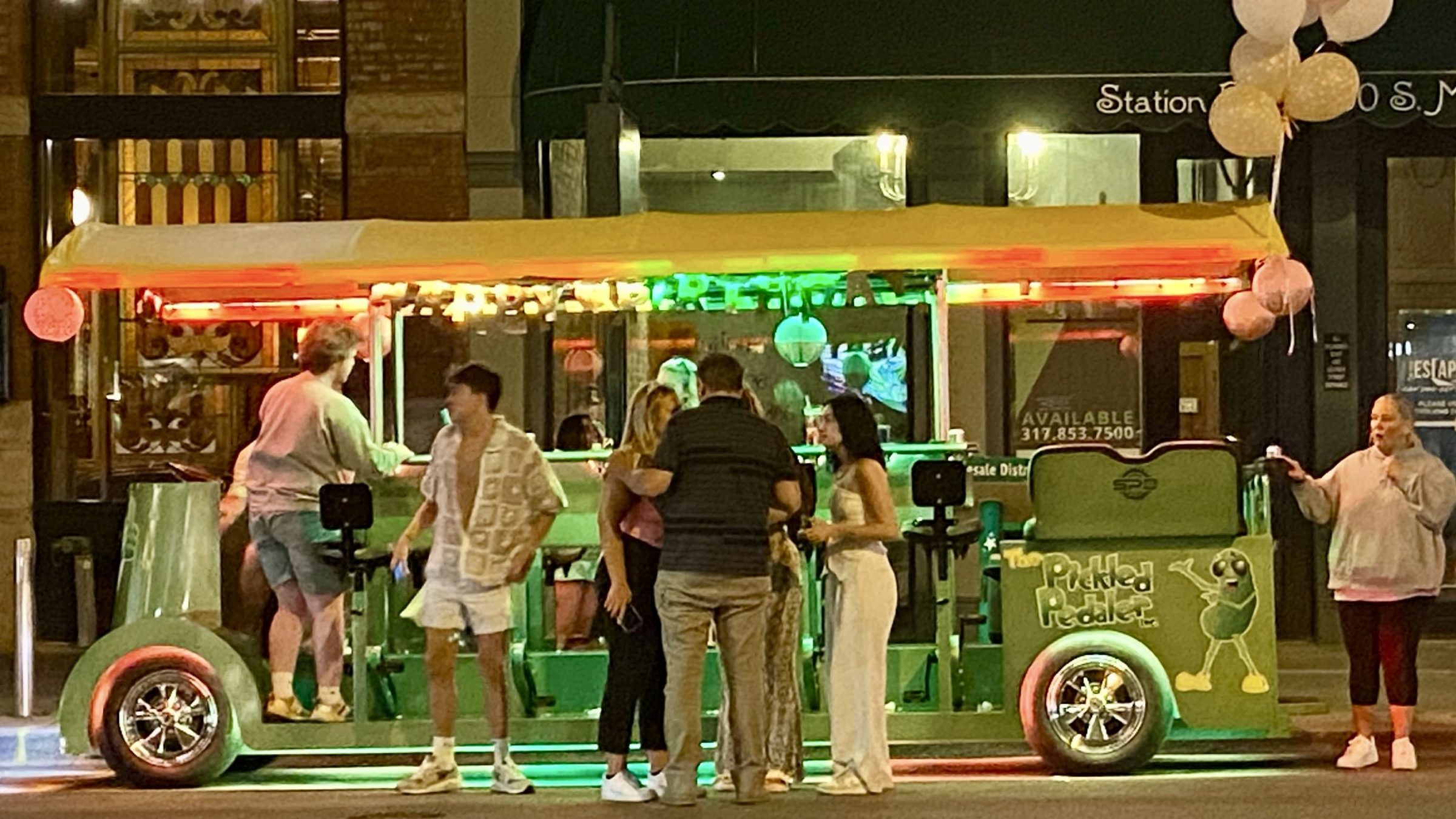 a group of people standing in front of a store