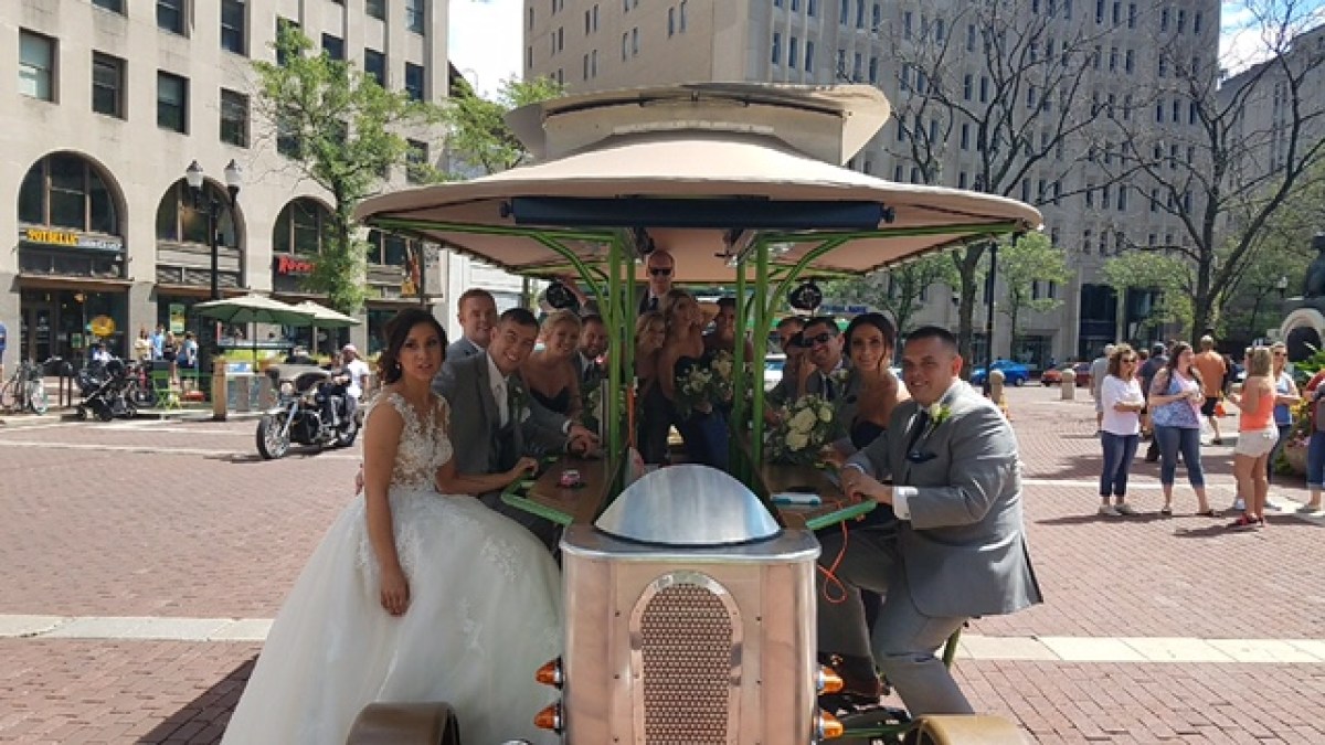 a group of people on a sidewalk